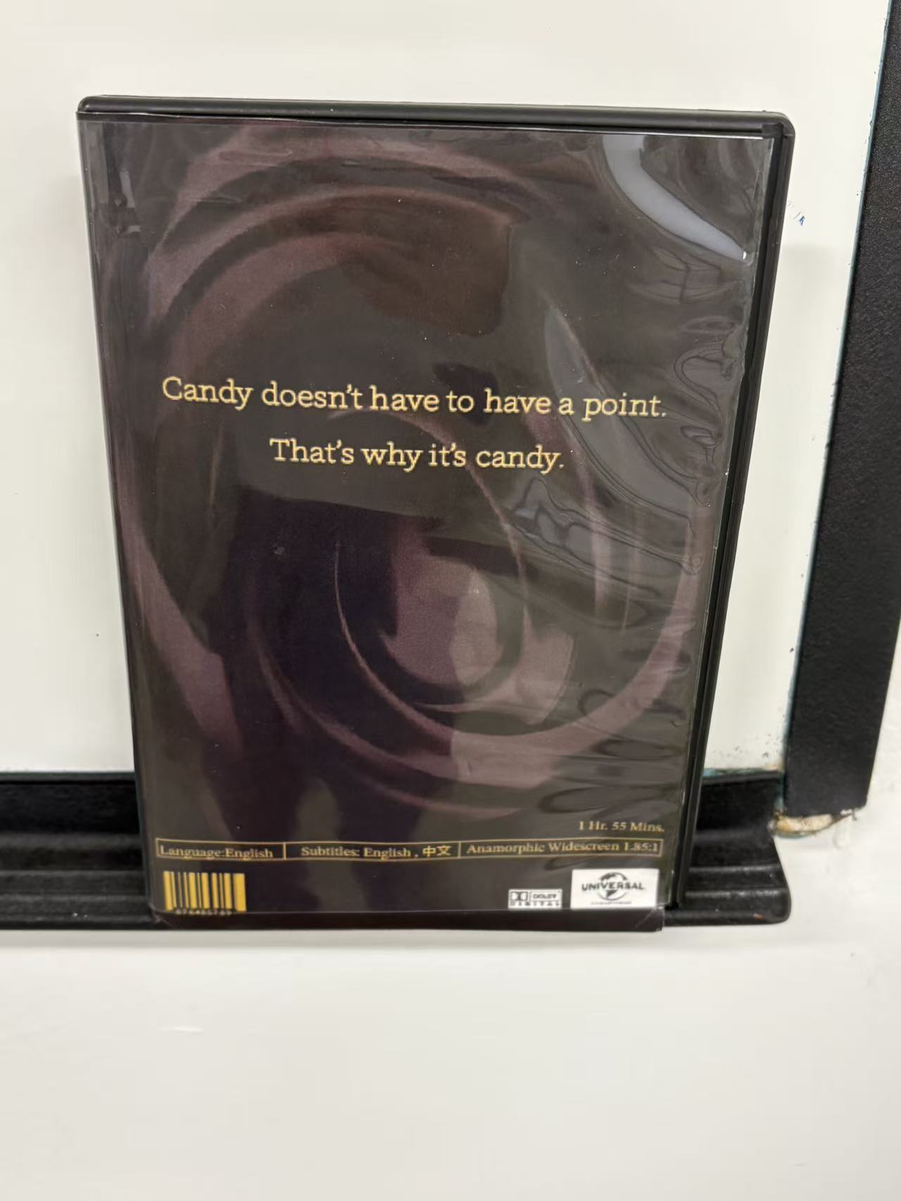 Charlie and the Chocolate Factory DVD case with golden inscription and Golden Ticket insert