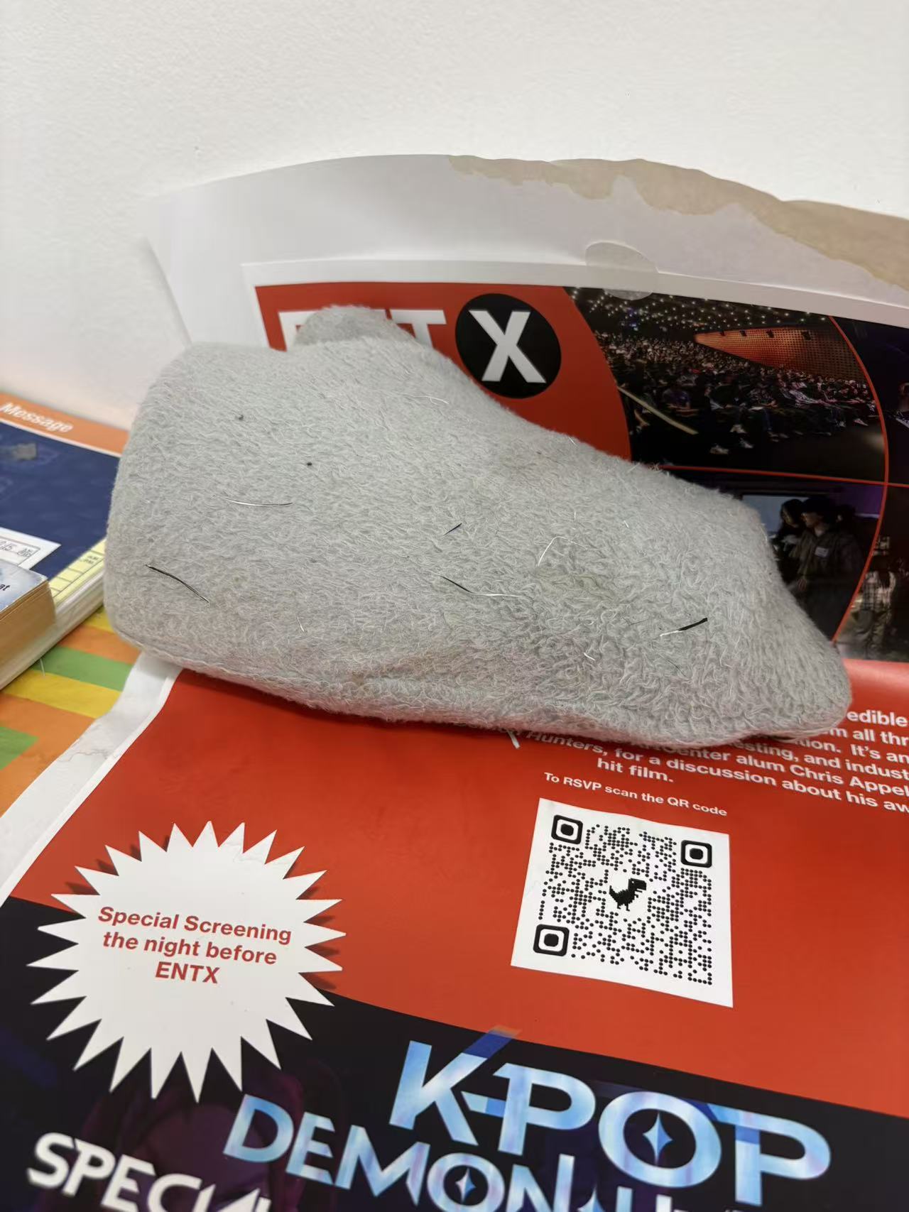 Thermos and plush bag, wider view of the desk