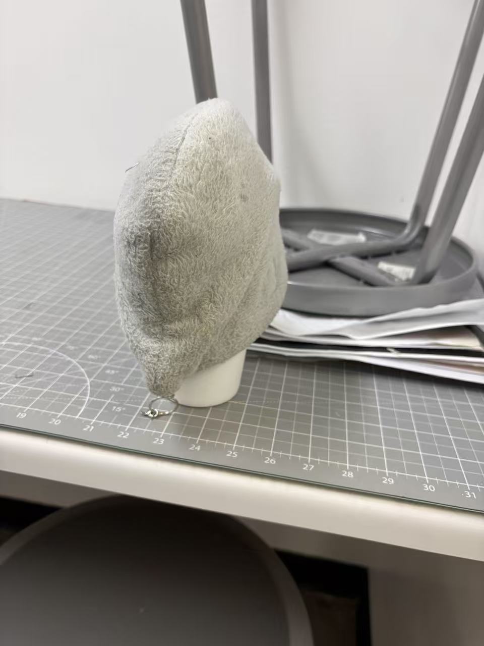 Thermos and plush bag, viewed from a distance after being displaced