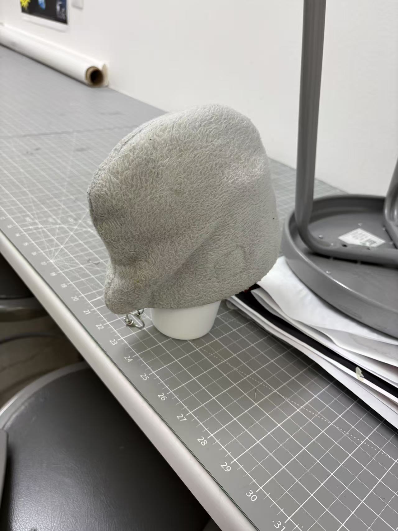 Thermos in plush bag, front view showing exposed base