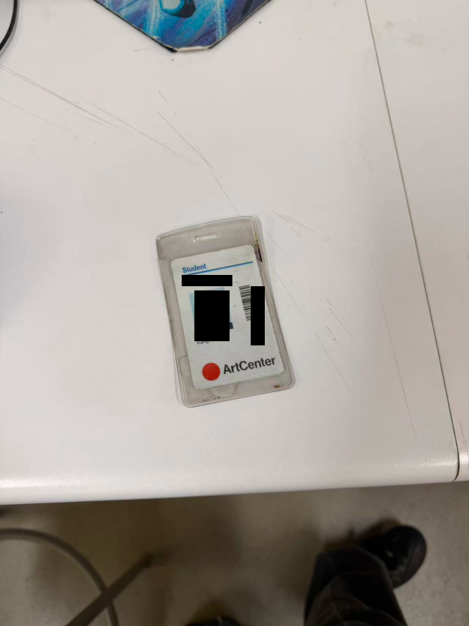 Student ID card on desk, viewed from farther away